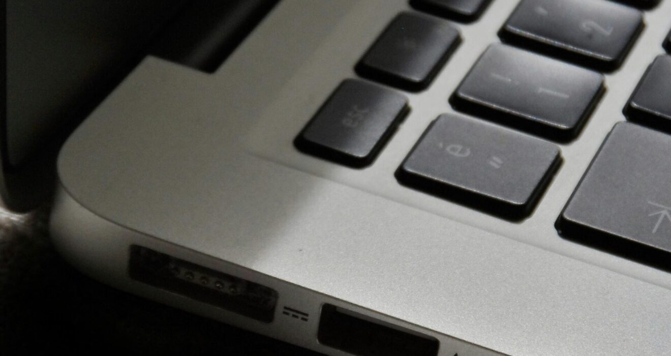 Free Detailed view of a silver laptop showing keyboard and multiple ports. Stock Photo